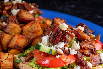Close Up Image of Bacon, avocado, tomato, cucumber, cheese and toast.