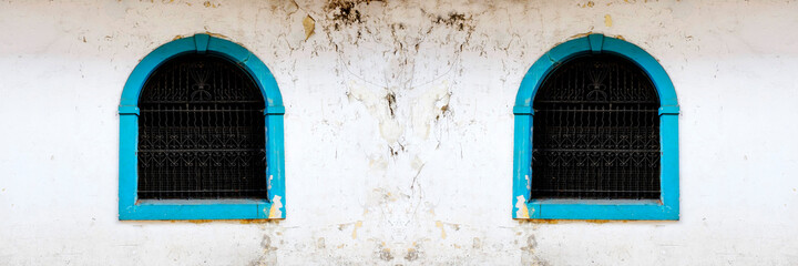 Old Window Painted Blue with Handworked Ironwork Bars