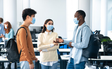 International students wearing medical masks and talking
