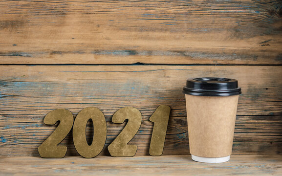 New Year Resolutions 2021 On Desk With Disposable Coffee Cup. Copy Space