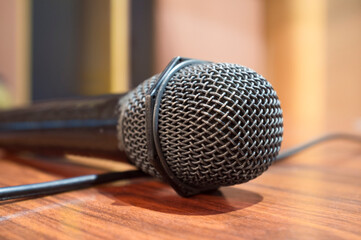 Macro microphone over wooden table