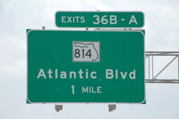 Exits 36B-A 814 Atlantic Blvd. 1 mile Sign Overhanging the Highway