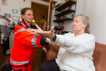 a paramedic conducts a medical examination on an old woman