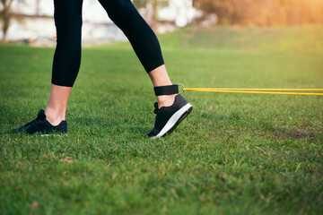 girl doing strength training with a rubber band