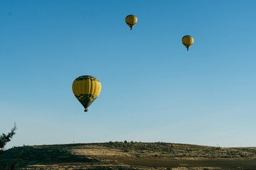 Segovia's landscape in sunrise with balloons