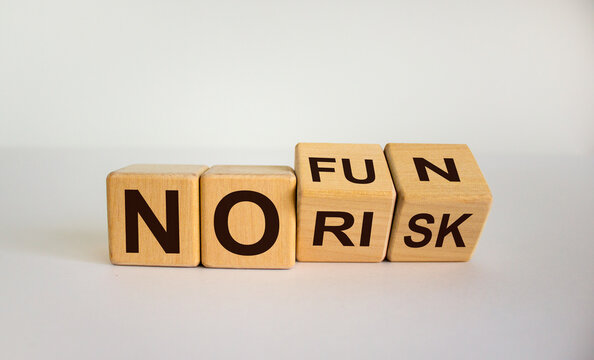 Slogan 'no Risk No Fun'. Turned Cubes And Changed The Words 'no Risk' To 'no Fun' Or Vice Versa. Beautiful White Background. Copy Space, Business Concept.