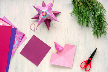 Step 4. Step by step instruction: how to make a christmas star out of colored cardboard.