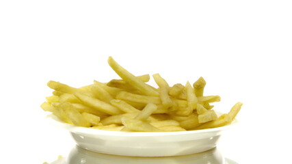 Golden french fries on plastic disposable plate rotating on isolated white background. Fast food concept, unhealthy junk food, tasty yummy fried potatoes. Copy text space