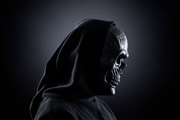 Fototapeta na wymiar Grim reaper in the dark