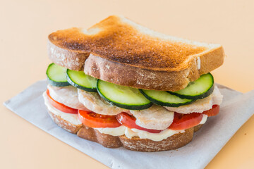 Sandwich chicken with tomato and cucumber