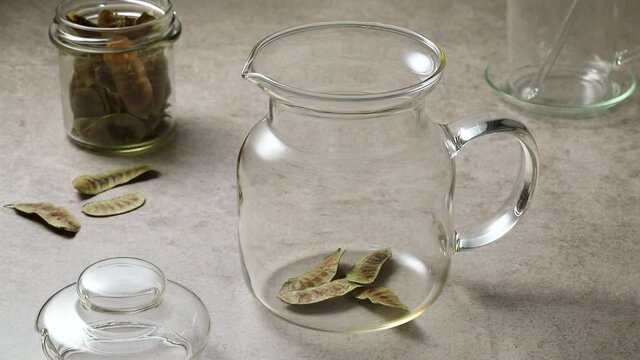  Making a glass pot of hot Senna tea with Senna pods