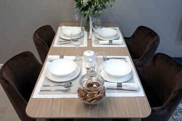table with cutlery lying on them