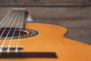 classic spanish guitar on wooden background. guitar with nylon strings