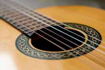 classic spanish guitar on wooden background. guitar with nylon strings
