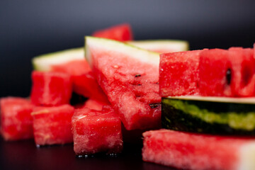 Watermelon slices and cubes of pulp in the center of the screen.