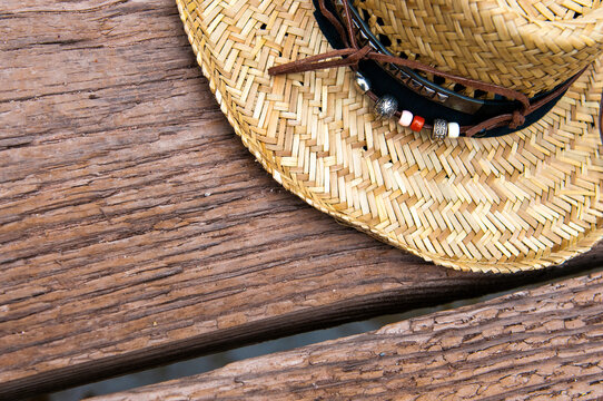straw hat on wooden background