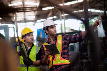 Professional engineering male and technician Machine operator control is checking operating in...
