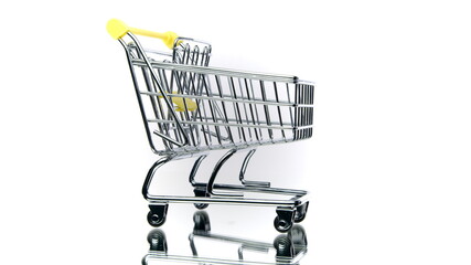 Small empty shopping cart rotating isolated on white background. Trolley in motion. Department...
