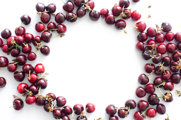 red raw fresh cherries on white background, close view 