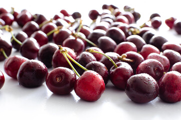 red raw fresh cherries on white background, close view 