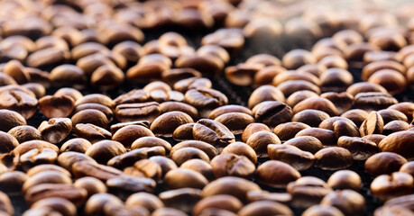 Broken coffee beans, background of roasting coffee beans 