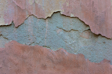 Obraz premium texture of brown old plaster on the street wall of the house. Warm shades