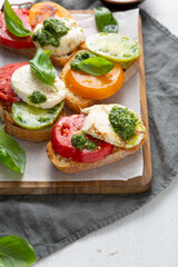 Caprese bruschetta on a wooden board