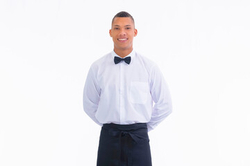 Young waiter standing up with hands in the back