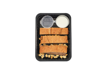 proper healthy diet
top view isolated white background, cereal bread with peanuts and white sauce in a container