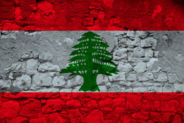 national flag of the state of Lebanon on the texture of a rough, old stone wall with cracks, the concept of historical, tourism, emigration, economy, politics, global world trade
