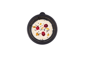 proper healthy diet
top view isolated white: white soup, raisins with nuts and berries, cumin seeds and cinnamon
