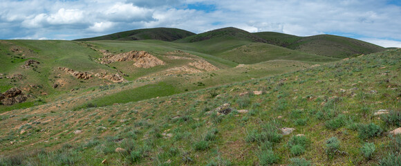 Picturesque hills with red rocks. Spring. Almaty region, Kazakhstan.