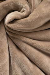 A warm blanket plush micro fleece fabric, swirled into a pattern background © 682A_IA
