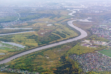 top view on the autumn river, the wood on the horizon, landscape. selective focus
