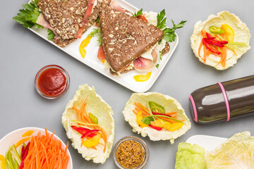 Vegan cabbage and carrot snack. Whole wheat sandwiches with sesame seeds and jamon