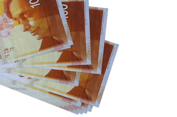 100 Israeli new shekels bills lies in small bunch or pack isolated on white. Mockup with copy...