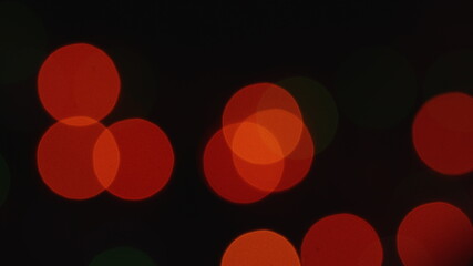 blurred dull shimmering Christmas lights bokeh backdrop. flickering multicolored lights abstract...