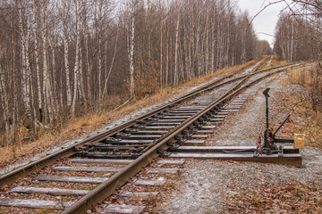 Fototapeta premium Old railway in the autumn forest.