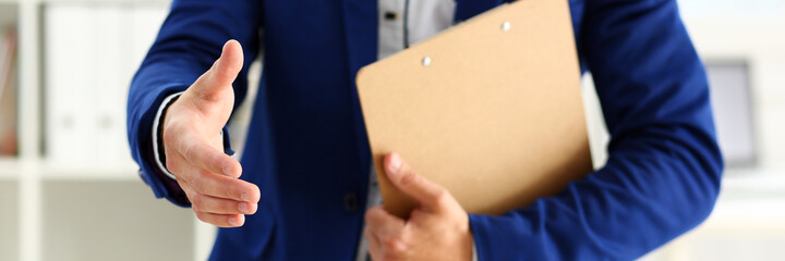 Businessman offer hand to shake as hello in office closeup. Serious business, friendly support...