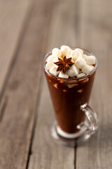 Hot chocolate with marshmallow on wooden table