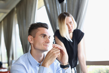 A group of people attending a seminar at a cafe listens attentively to each other's lecturers and also brings their ideas to business education in an informal setting