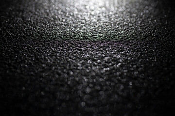 Black material texture with shining light