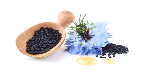 Black cumin seeds with flower on white background