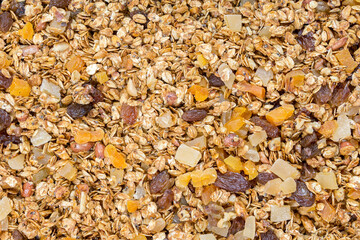 granola with nuts and mango raisins, Chia seeds. Food for Breakfast. Food background, granule texture.