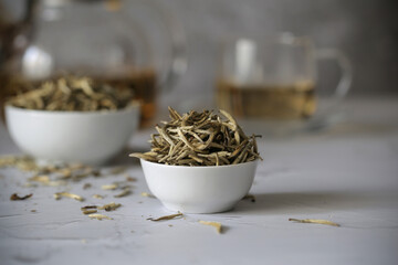 tea dry white silver needles is on the table	