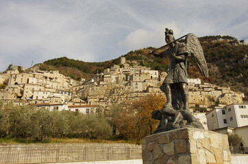 In the foreground the statue of San Michele and the dragon and in the background the characteristic...