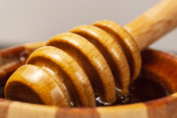 bucket of collecting from a jar of honey. Jars of honey. close-up macro