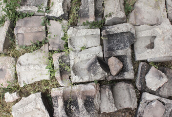 string, background of stones, broken bricks and blocks