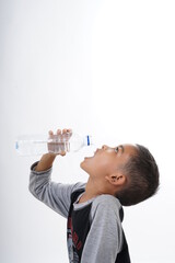 Schoolboy drinking mineral water