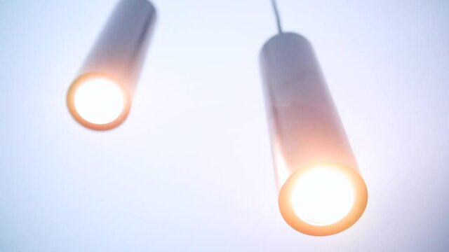 Fluorescent lamps on the ceiling. Building interior decoration. Soft, warm light, comfort in the room.